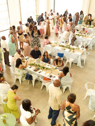 Guests gather around beautifully set tables at a TG Lifestyle Collective experience