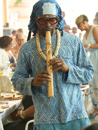 A musician performs during Heritage Social Brunch